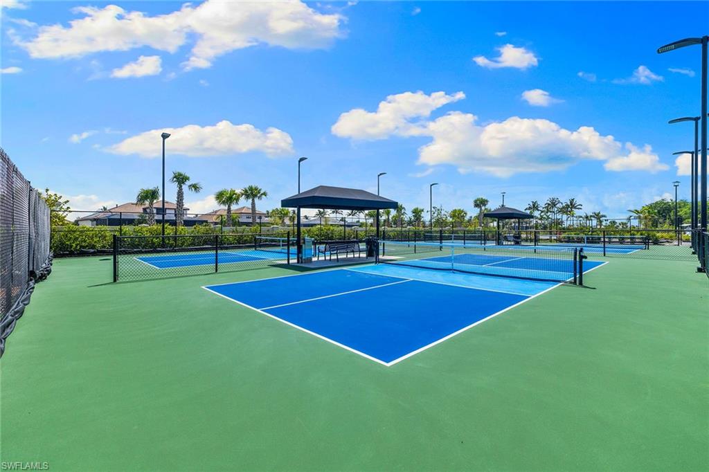 15345 Aprile Street Naples, FL 34114 - Photo 28 of 29 a view of a tennis court