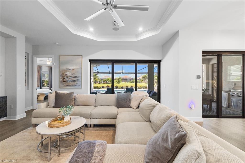 15345 Aprile Street Naples, FL 34114 - Photo 5 of 29 a living room with furniture and a large window