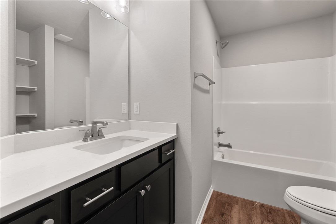 2869 Messenger Way Bryan, TX 77803 - Photo 20 of 23 a bathroom with a sink a toilet and shower