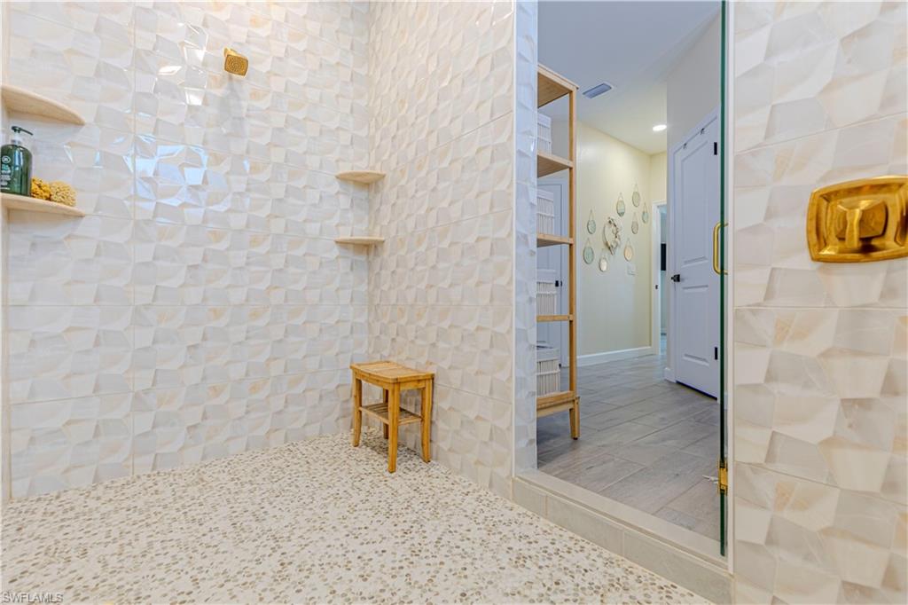 20278 Kingmont Drive Estero, FL 33928 - Photo 24 of 38 Bathroom with a tile shower