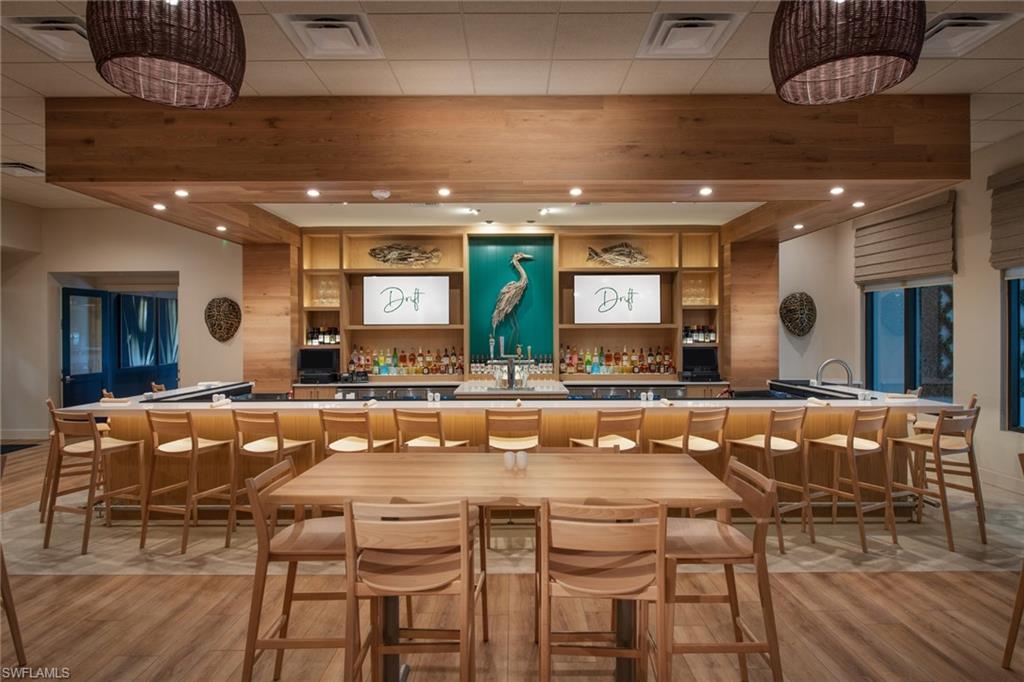 20278 Kingmont Drive Estero, FL 33928 - Photo 30 of 38 Bar featuring beam ceiling and light hardwood / wood-style floors