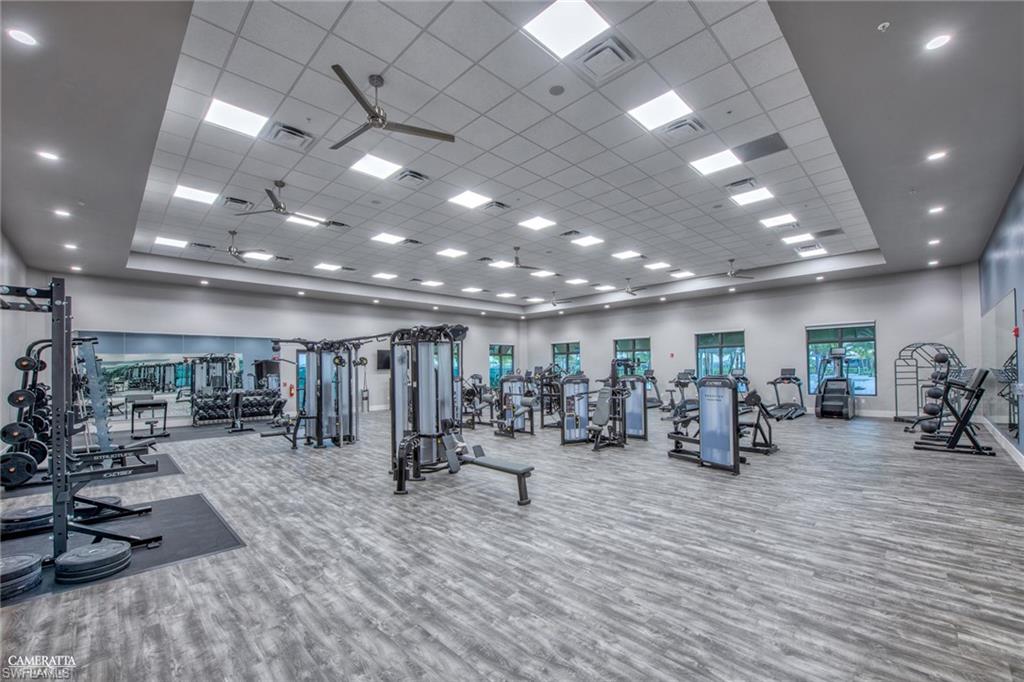 20278 Kingmont Drive Estero, FL 33928 - Photo 37 of 38 Gym featuring a drop ceiling and a high ceiling