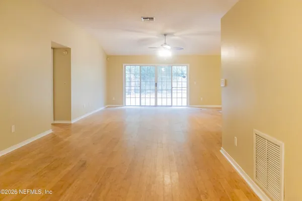 a view of an empty room with a window