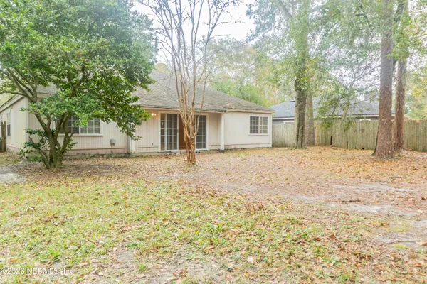 a house with trees in front of it