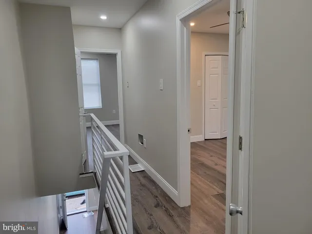 a view of a hallway with stairs