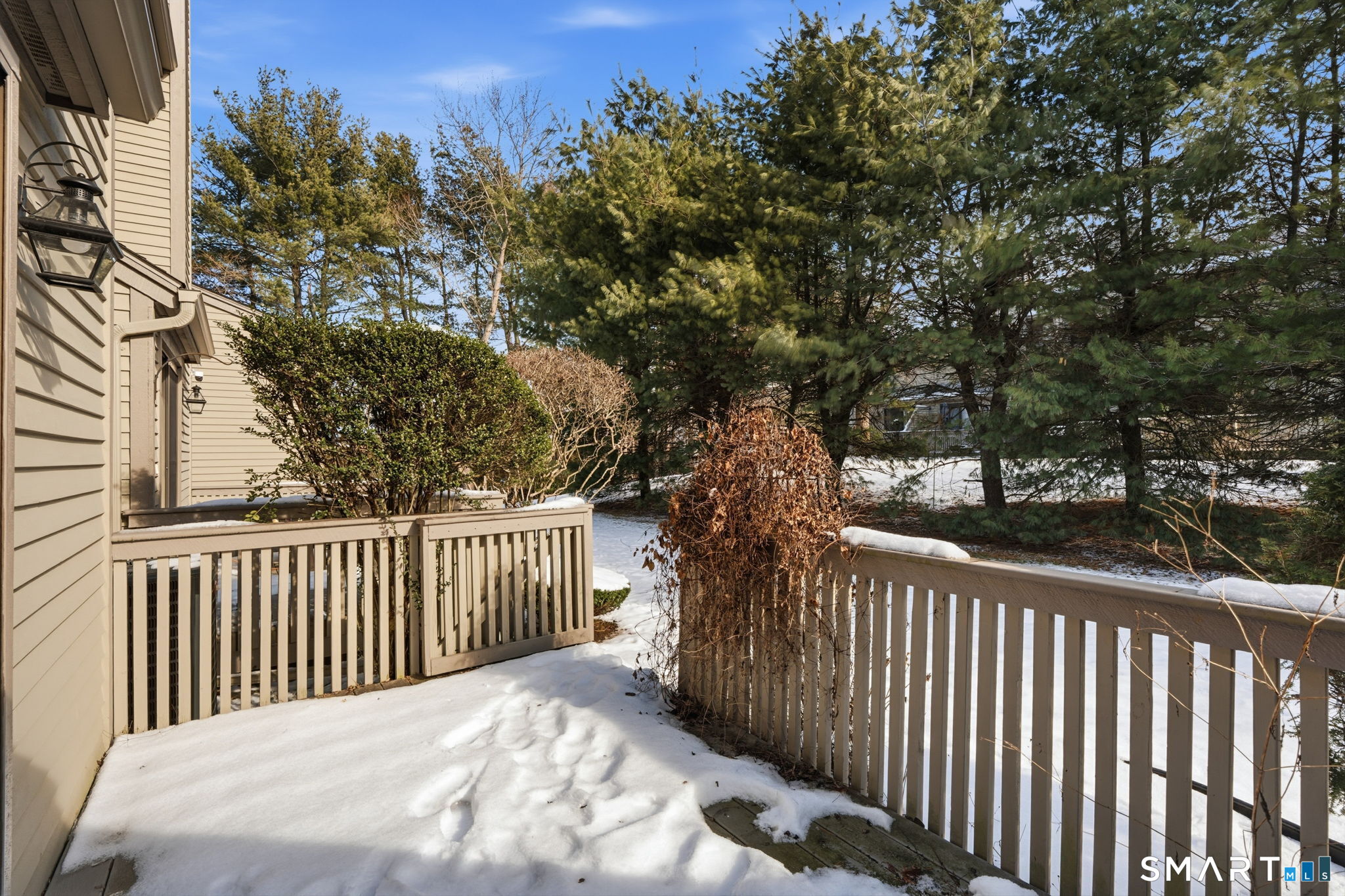 73 Metacomet Drive, Unit 73 Meriden, CT 06450 - Photo 30 of 37 a porch with a trees in front of it