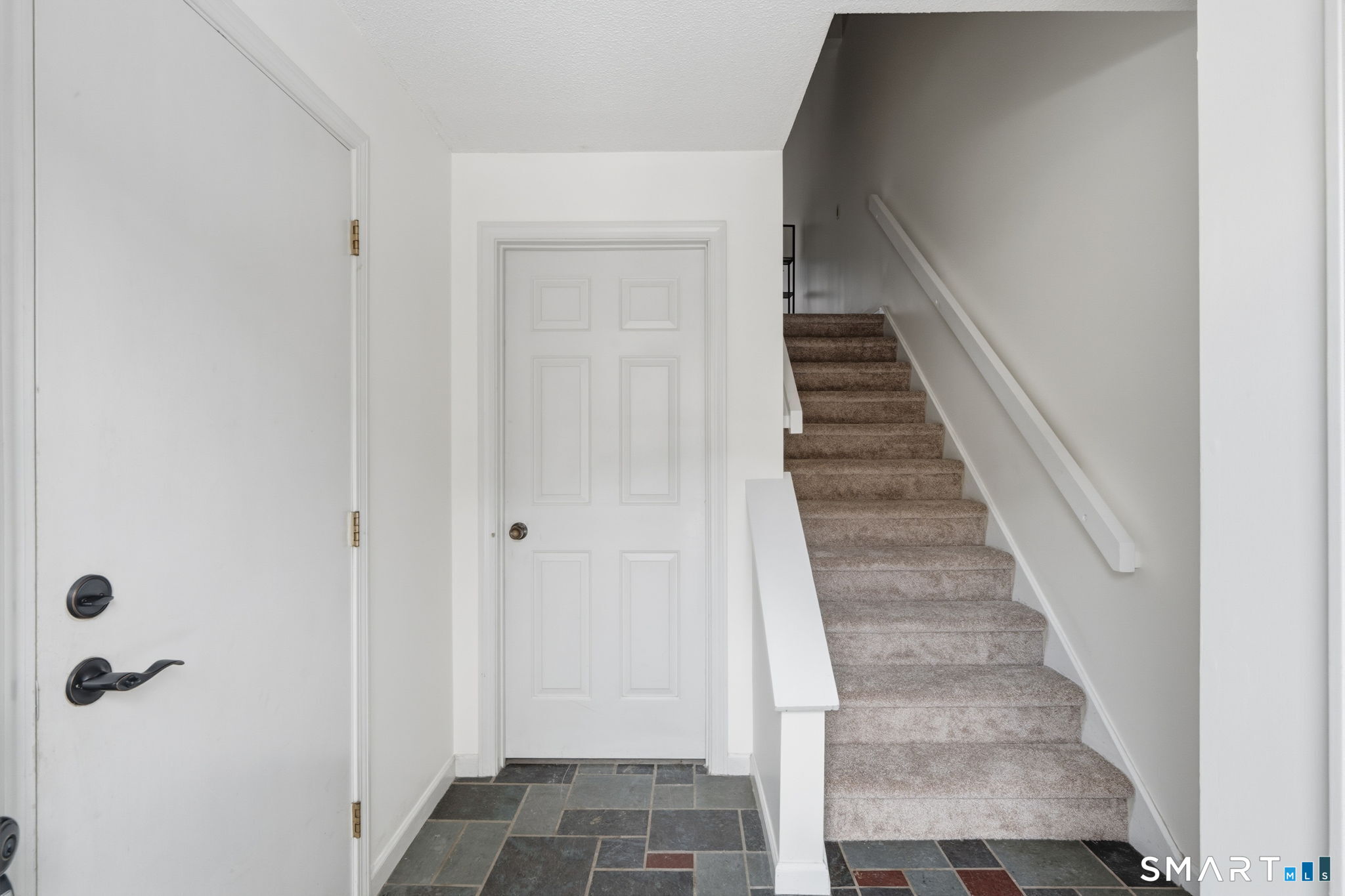 73 Metacomet Drive, Unit 73 Meriden, CT 06450 - Photo 4 of 37 a view of a hallway with entryway