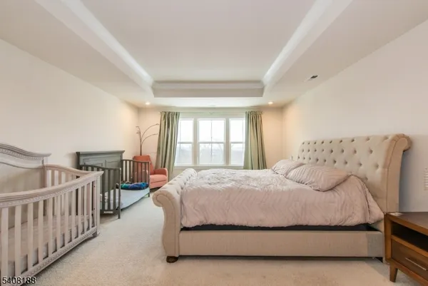 a bedroom with bed and a window