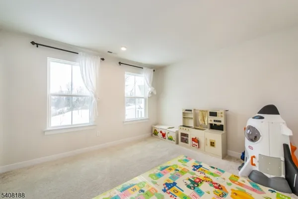 a bed room with furniture and a window