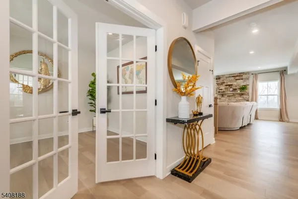 a view of living room with furniture and wooden floor