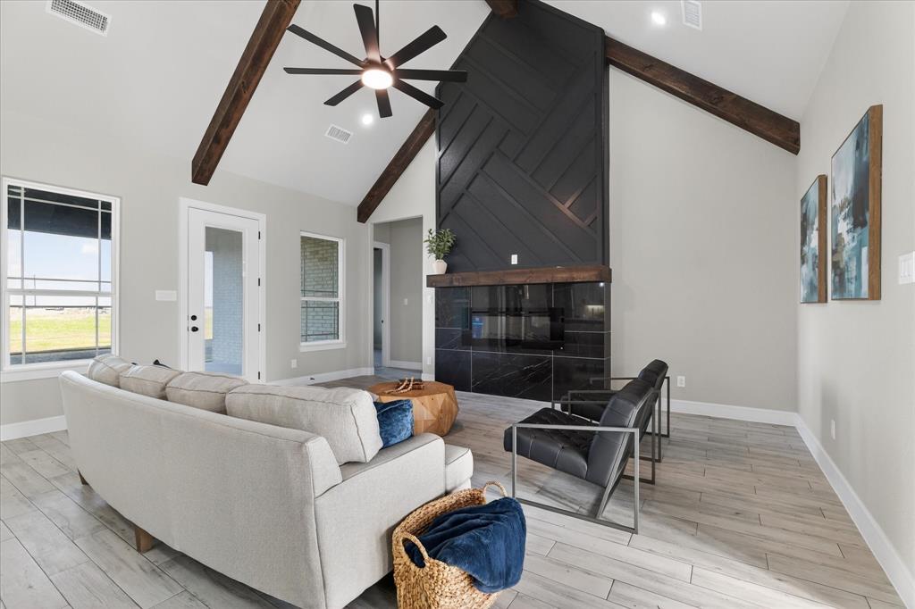 556 County Road 4875 Celeste, TX 75423 - Photo 8 of 40 a living room with furniture and a wooden floor