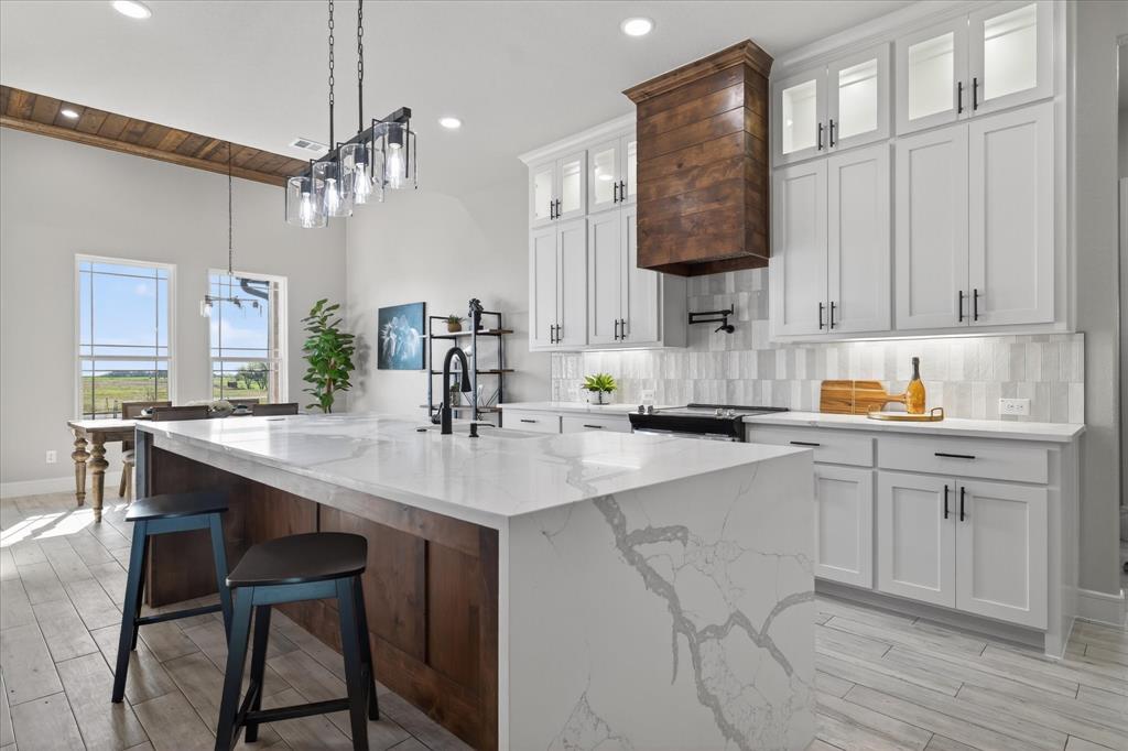 556 County Road 4875 Celeste, TX 75423 - Photo 10 of 40 a kitchen with a sink cabinets and window