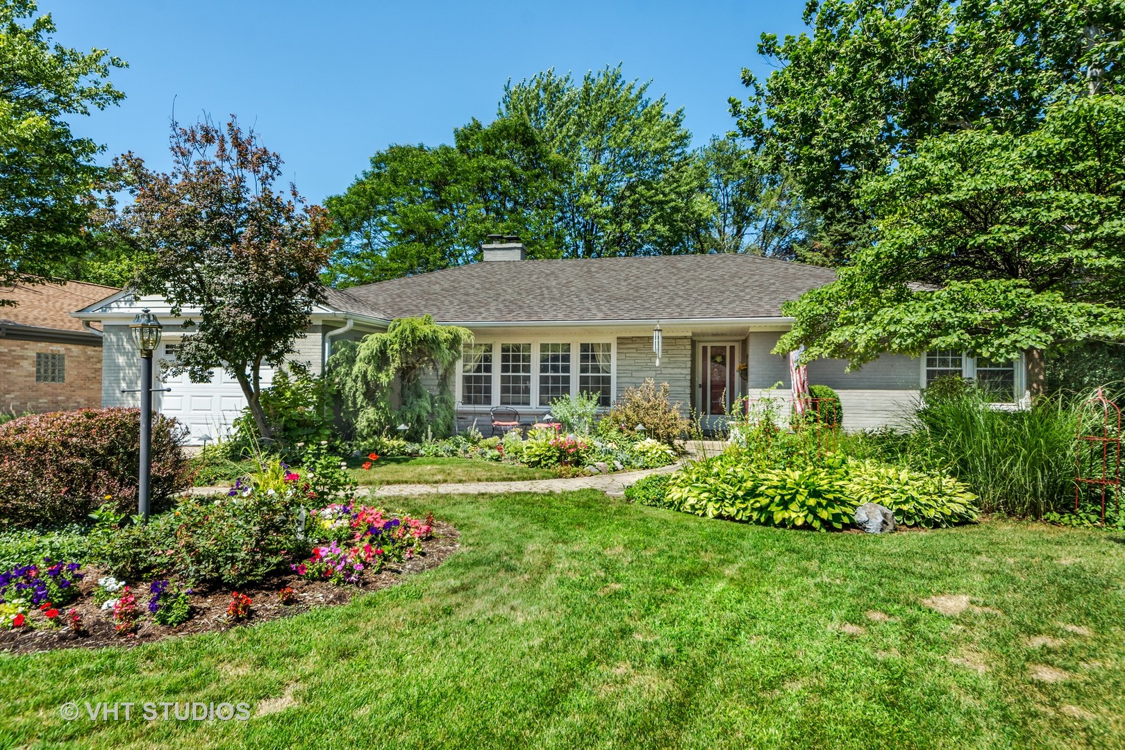 1850 Burton Lane Park Ridge, IL 60068 - Photo 1 of 34 a house with lots of flowers in it