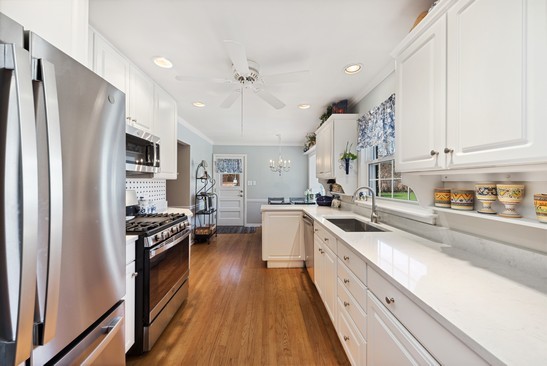 1850 Burton Lane Park Ridge, IL 60068 - Photo 15 of 34 a large kitchen with stainless steel appliances granite countertop a lot of counter space and wooden floor