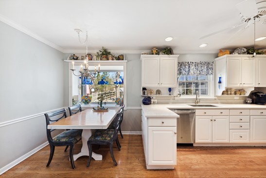 1850 Burton Lane Park Ridge, IL 60068 - Photo 17 of 34 a kitchen with a dining table chairs sink and stove