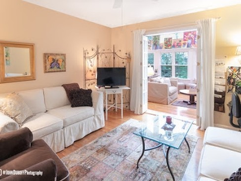 1850 Burton Lane Park Ridge, IL 60068 - Photo 24 of 34 a living room with furniture a large window and a flat screen tv