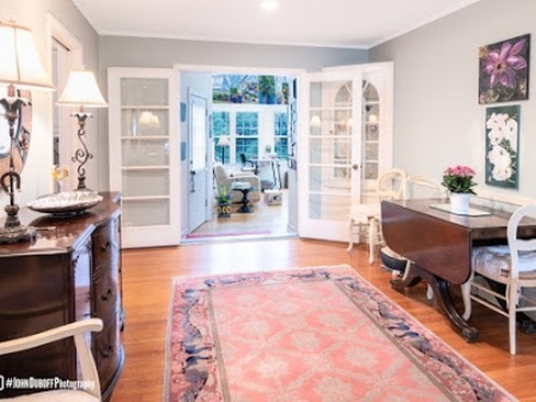 1850 Burton Lane Park Ridge, IL 60068 - Photo 25 of 34 a living room with furniture a fireplace and a floor to ceiling window