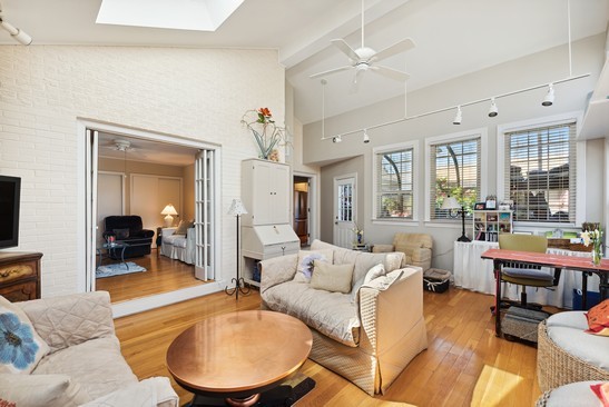1850 Burton Lane Park Ridge, IL 60068 - Photo 34 of 34 a living room with furniture potted plant and a large window