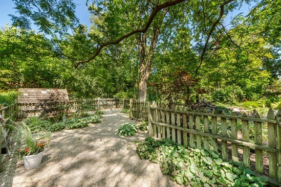 1850 Burton Lane Park Ridge, IL 60068 - Photo 8 of 34 a view of a garden with large trees