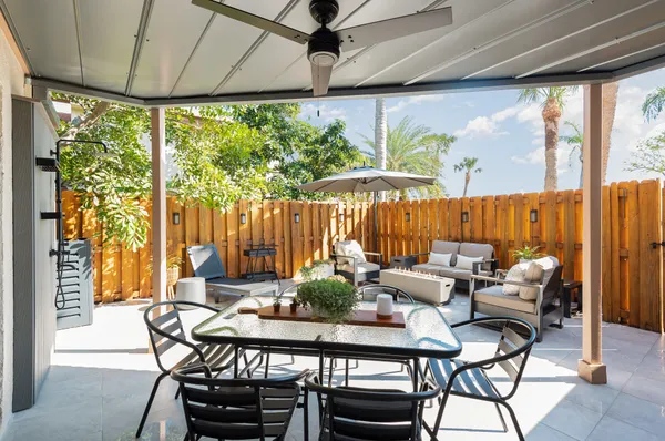 a outdoor dining space with furniture and outdoor view
