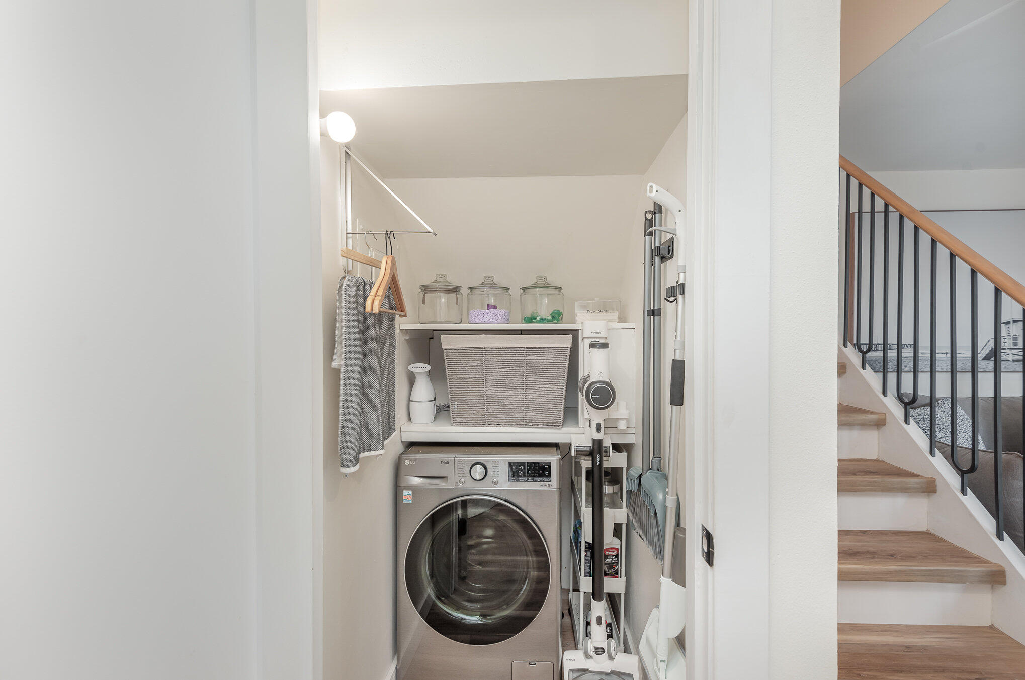 200 South Banana River Boulevard, Unit 804 Cocoa Beach, FL 32931 - Photo 11 of 31 a view of a hallway with washer and dryer