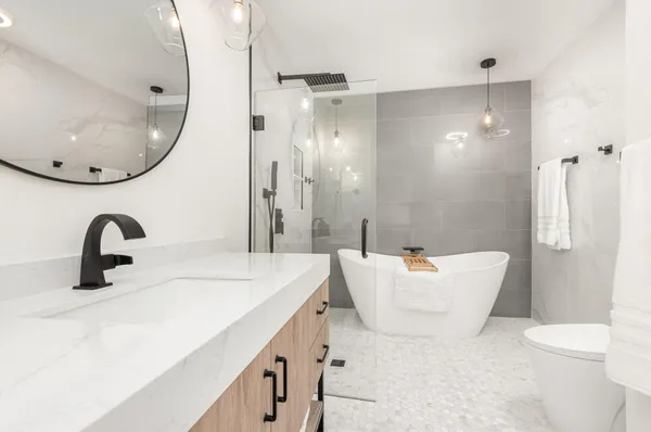 a bathroom with a sink a toilet and a mirror