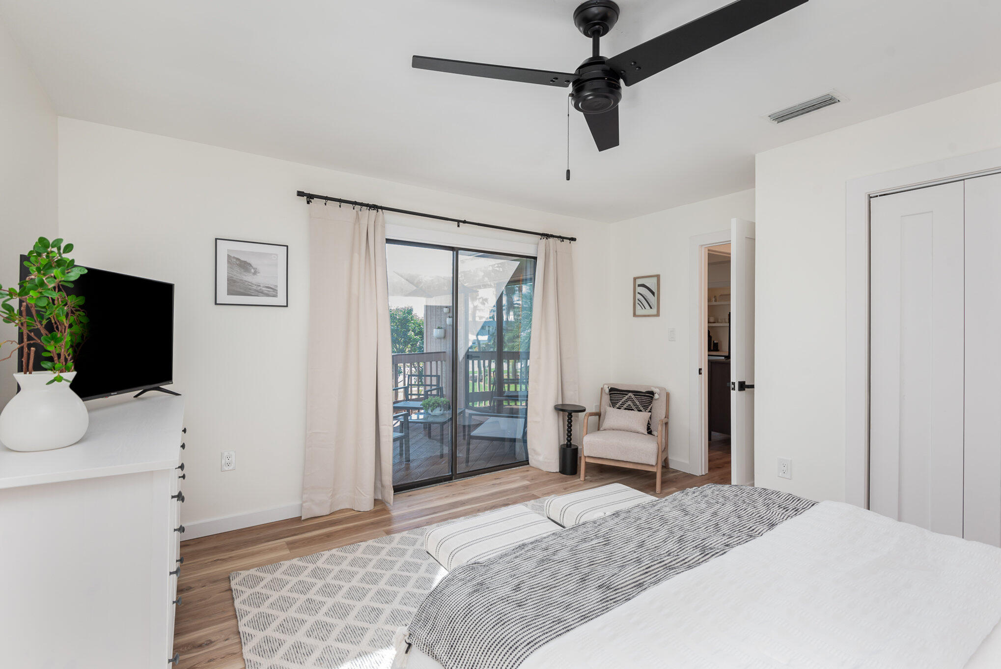 200 South Banana River Boulevard, Unit 804 Cocoa Beach, FL 32931 - Photo 17 of 31 a bedroom with a bed and flat screen tv