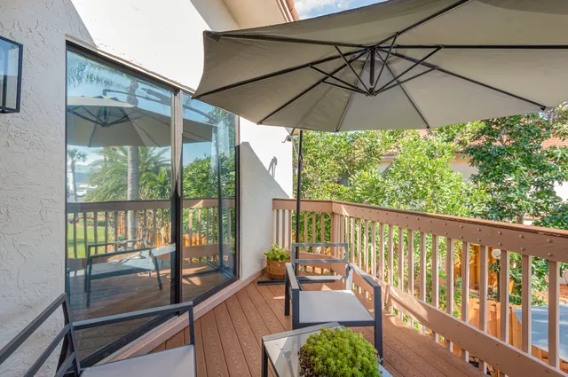 a view of a two chairs in the balcony