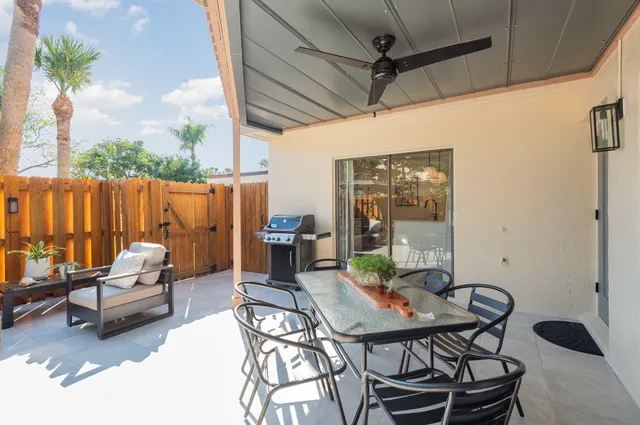 a swimming pool with outdoor seating and yard