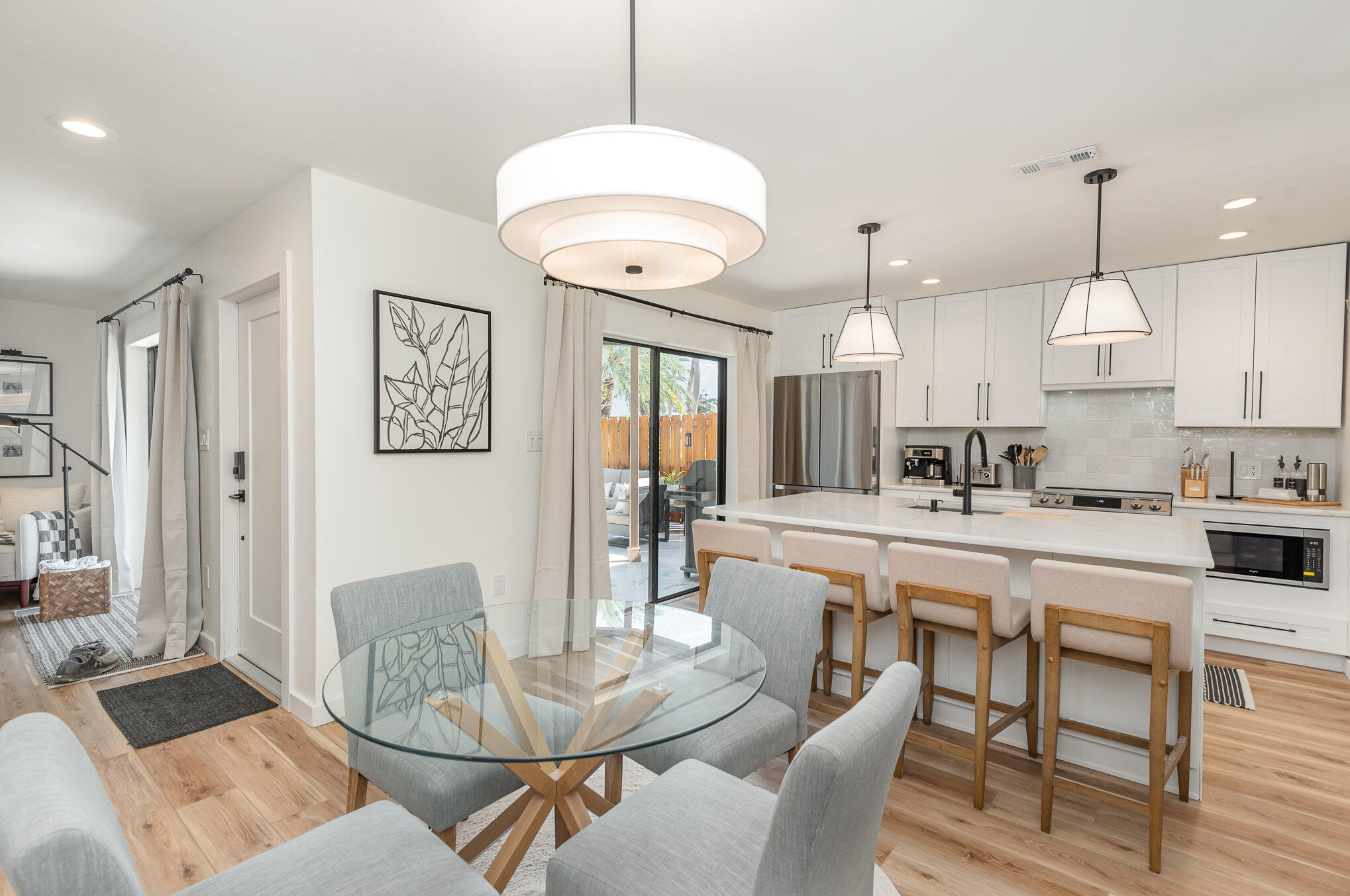 200 South Banana River Boulevard, Unit 804 Cocoa Beach, FL 32931 - Photo 5 of 31 a large kitchen with a table and chairs