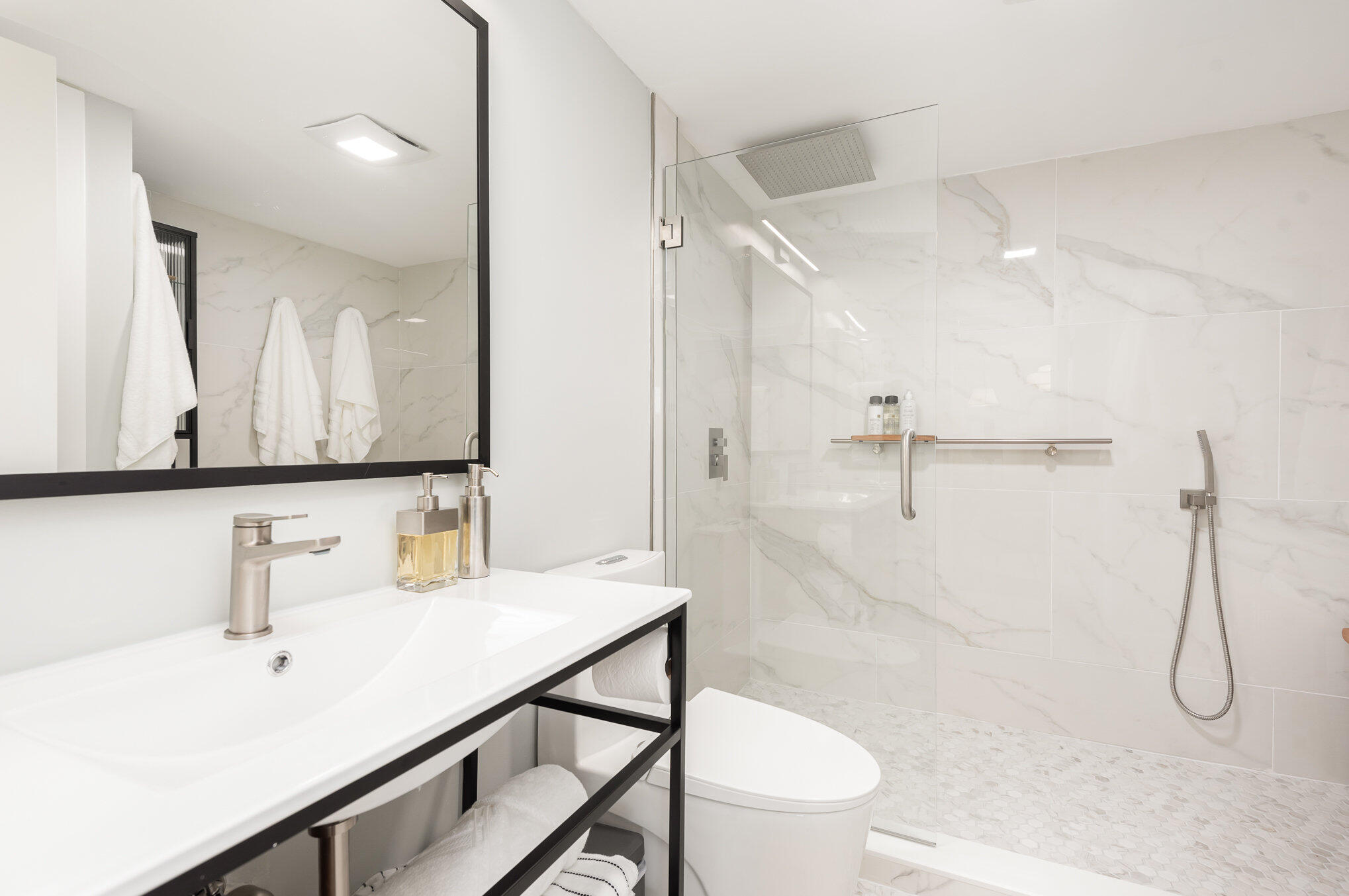 200 South Banana River Boulevard, Unit 804 Cocoa Beach, FL 32931 - Photo 10 of 31 a bathroom with a sink a toilet and shower