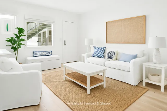 a living room with furniture and a rug