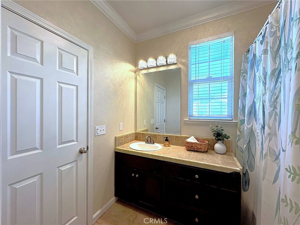 154 Montage Drive Merced, CA 95348 - Photo 11 of 18 a bathroom with a sink and a mirror