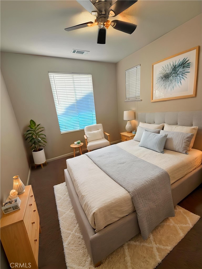 154 Montage Drive Merced, CA 95348 - Photo 7 of 18 a bedroom with a bed and a chandelier