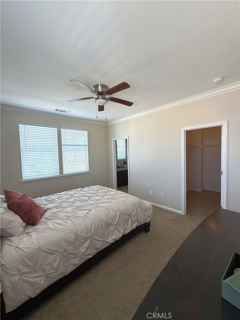 154 Montage Drive Merced, CA 95348 - Photo 10 of 18 a bedroom with a bed and a large window