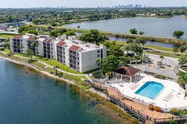 aerial view of a house with a lake view