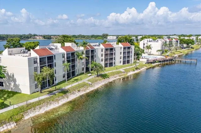 a view of a patio with swimming pool and a yard
