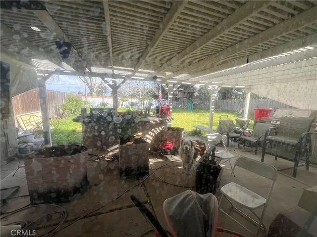 a view of a chairs and tables in patio