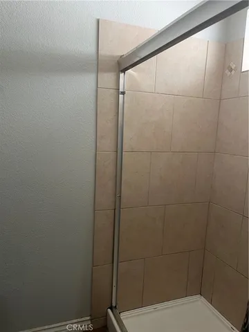 a bathroom with a toilet and shower
