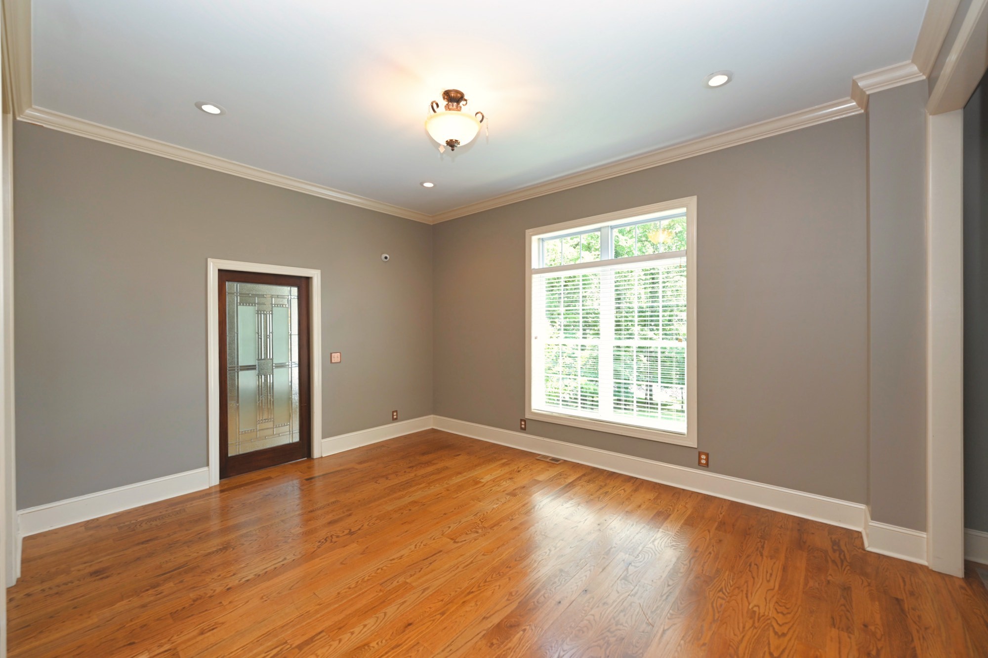 125 Happy Hollow Road Goodlettsville, TN 37072 - Photo 42 of 92 a view of an empty room with wooden floor and a window