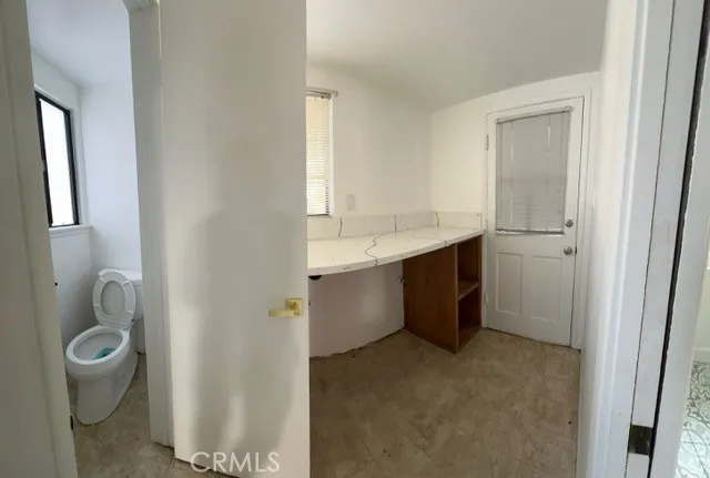 a room with a sink and toilet