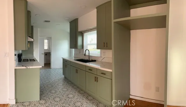 a large bathroom with a granite countertop sink and a mirror