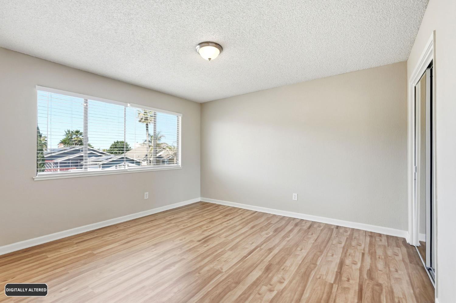 5501 Riverlake Road Discovery Bay, CA 94505 - Photo 45 of 60 wooden floor in an empty room with a window