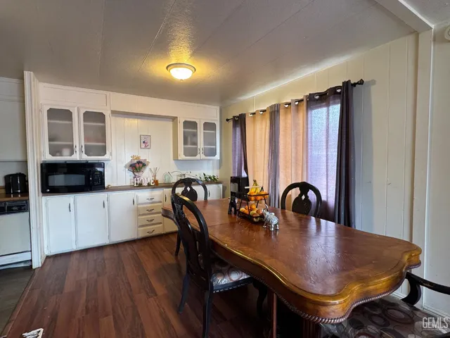 a view of a dining room with furniture and window