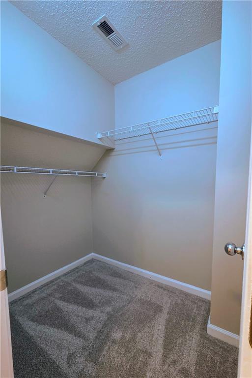 108 Riley Way Canton, GA 30115 - Photo 17 of 33 a view of a room with racks on the wall