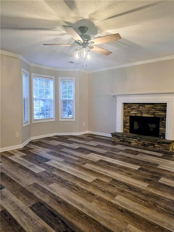 108 Riley Way Canton, GA 30115 - Photo 2 of 33 a view of an empty room with a fireplace and a window