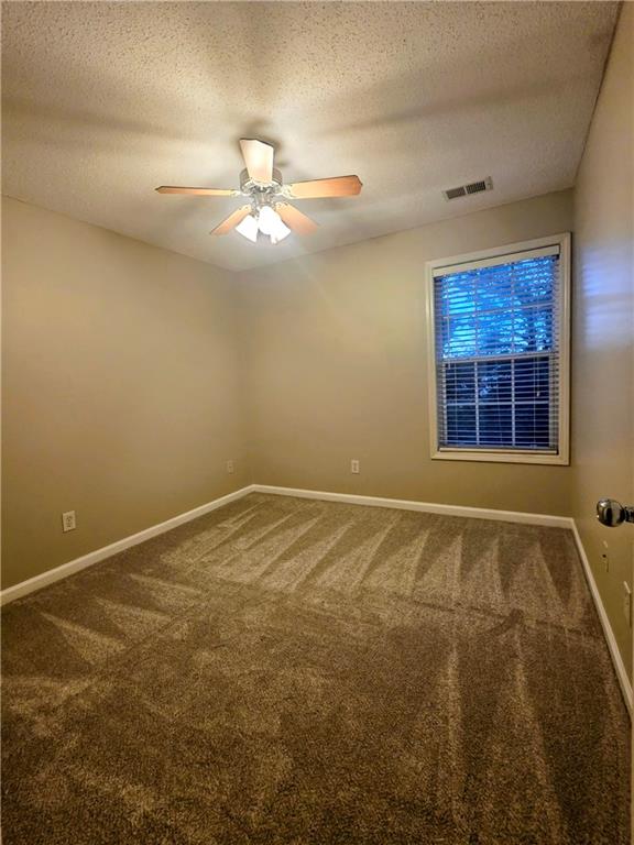 108 Riley Way Canton, GA 30115 - Photo 23 of 33 a view of an empty room with a window