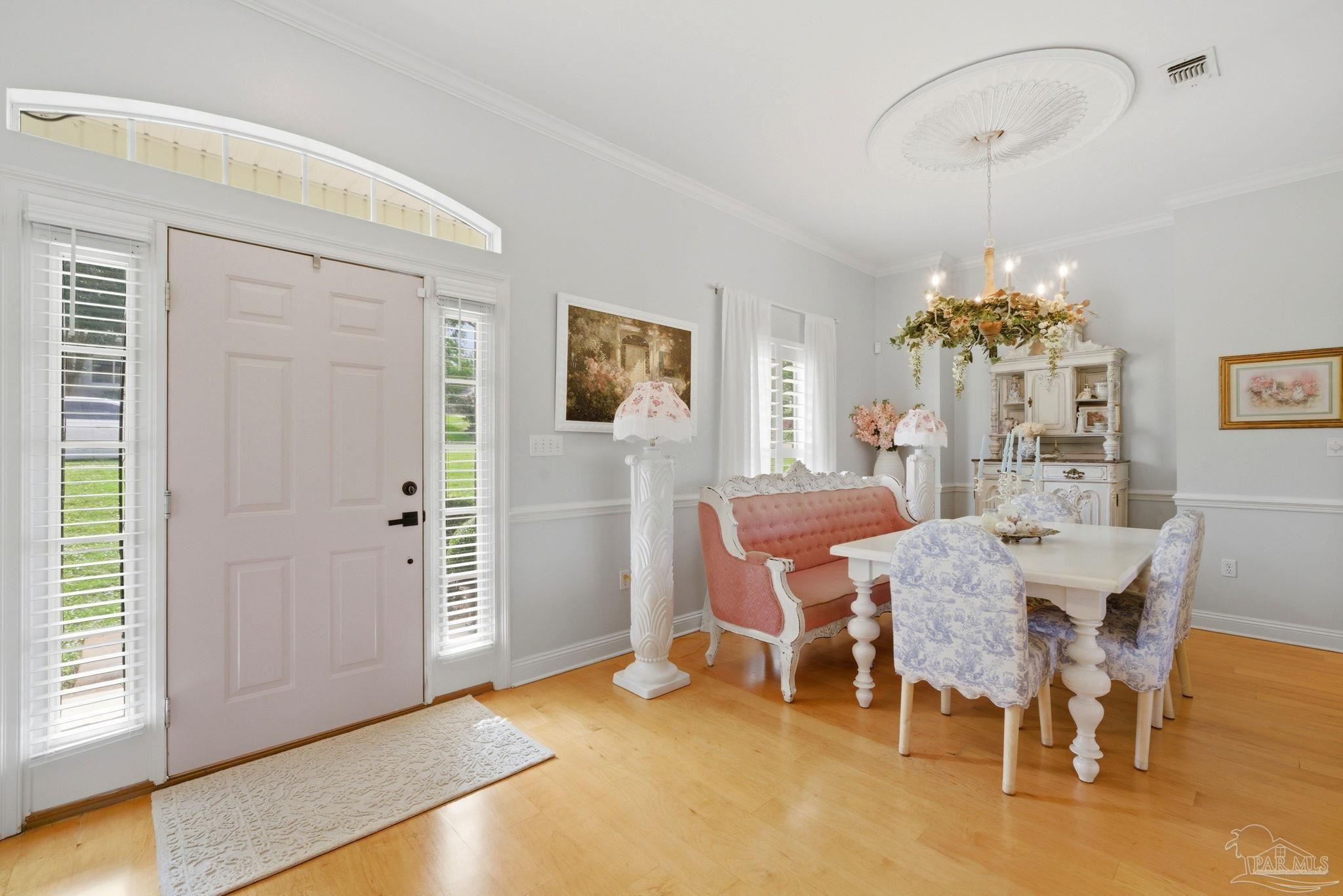 5931 Otter Point Road Pensacola, FL 32504 - Photo 7 of 67 a view of a dining room with furniture and chandelier
