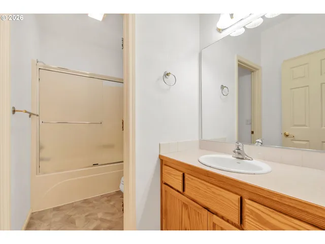 a bathroom with a shower and a toilet