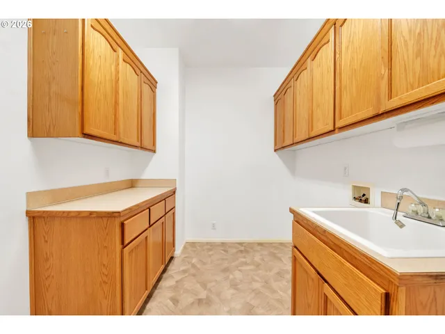 a bathroom with a sink a mirror and a shower